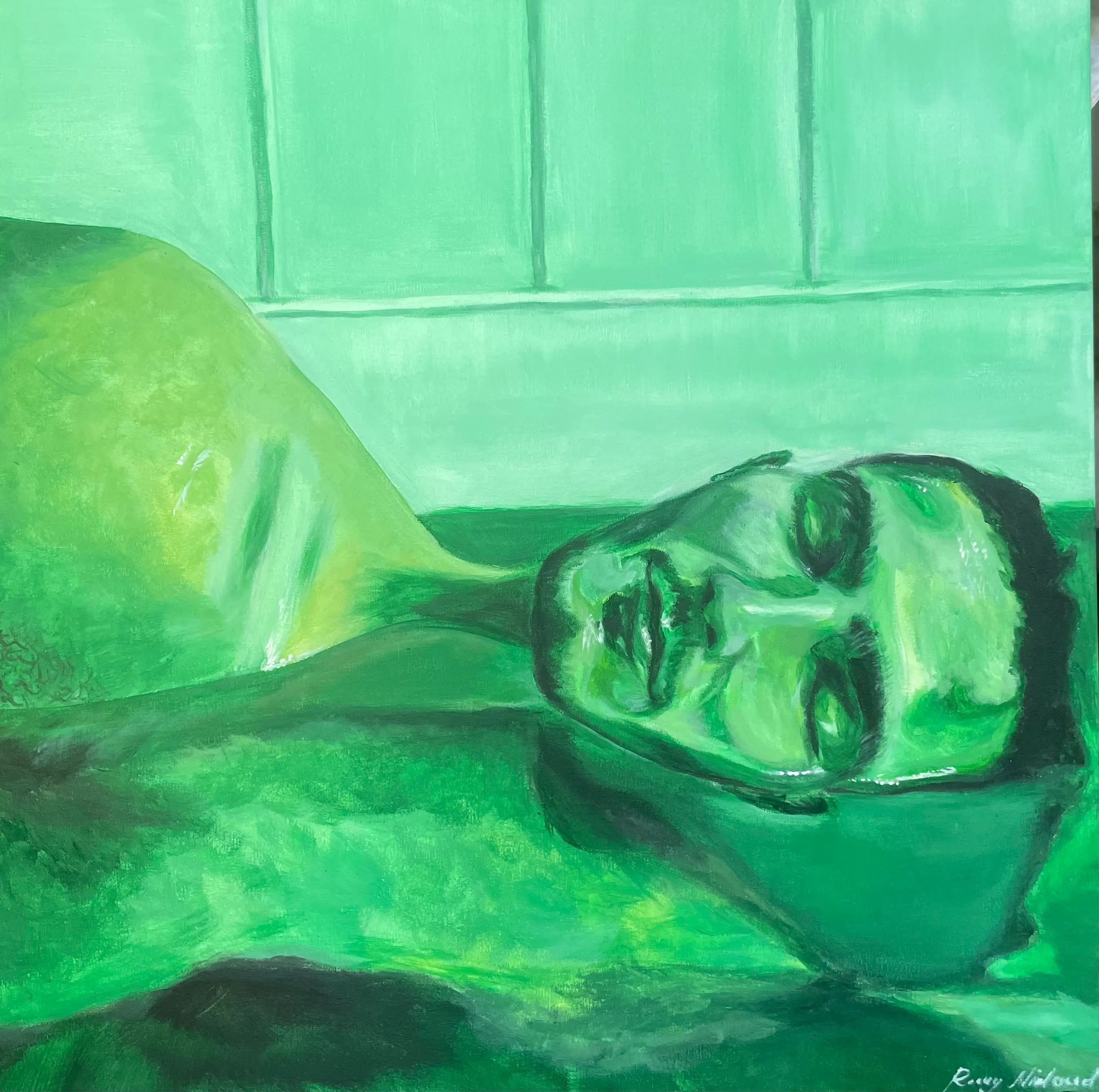 Portrait of man laying in water, with green lighting