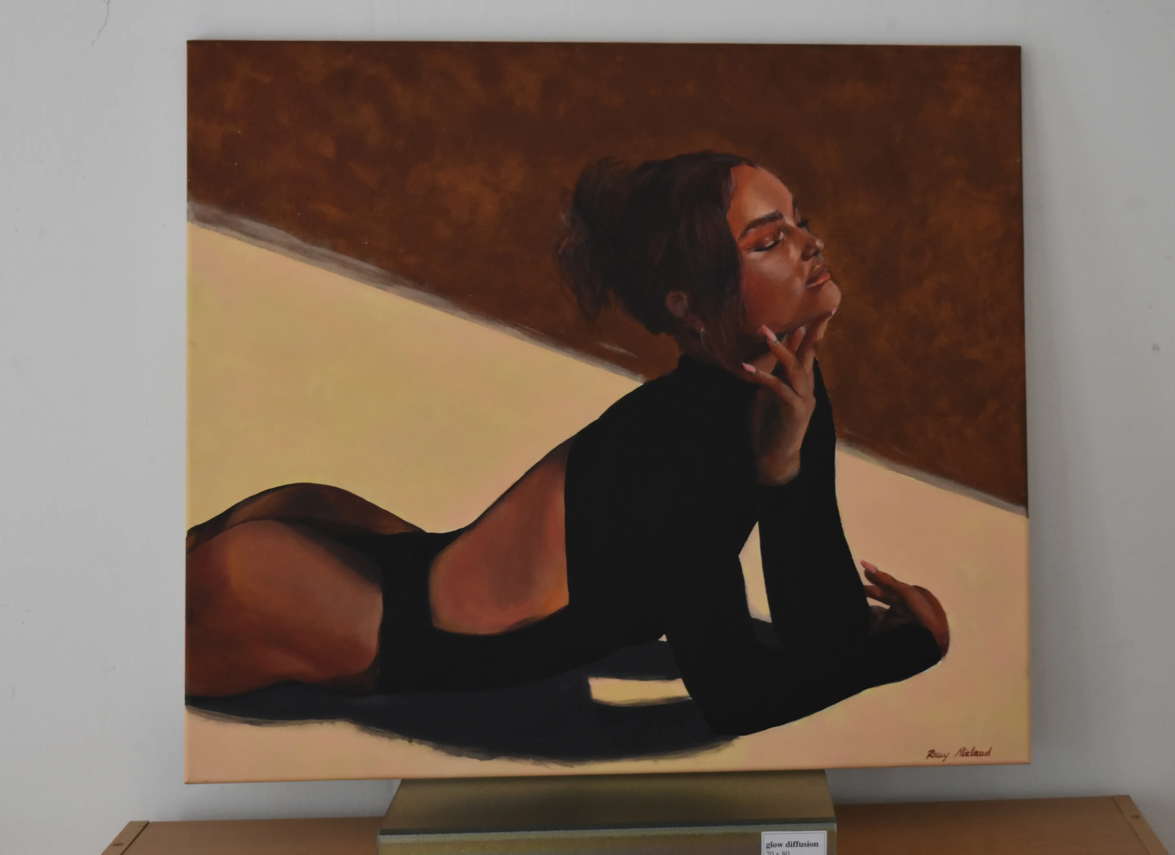 Portrait of woman laying down, with red lighting