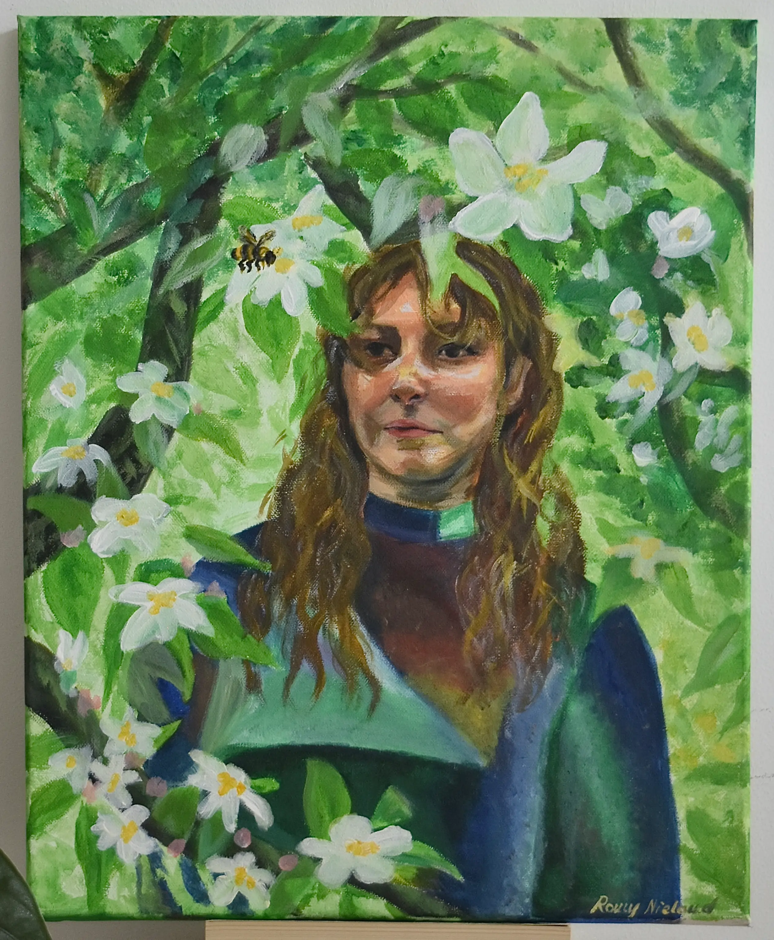 Portrait of woman surrounded by foliage