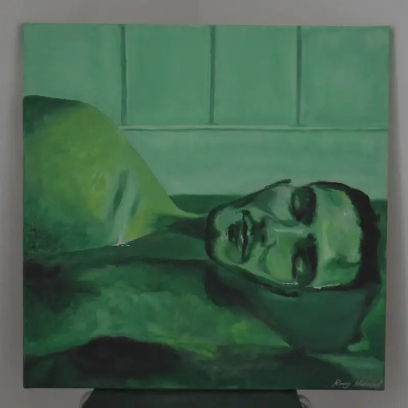 Portrait of man laying in water, with green lighting